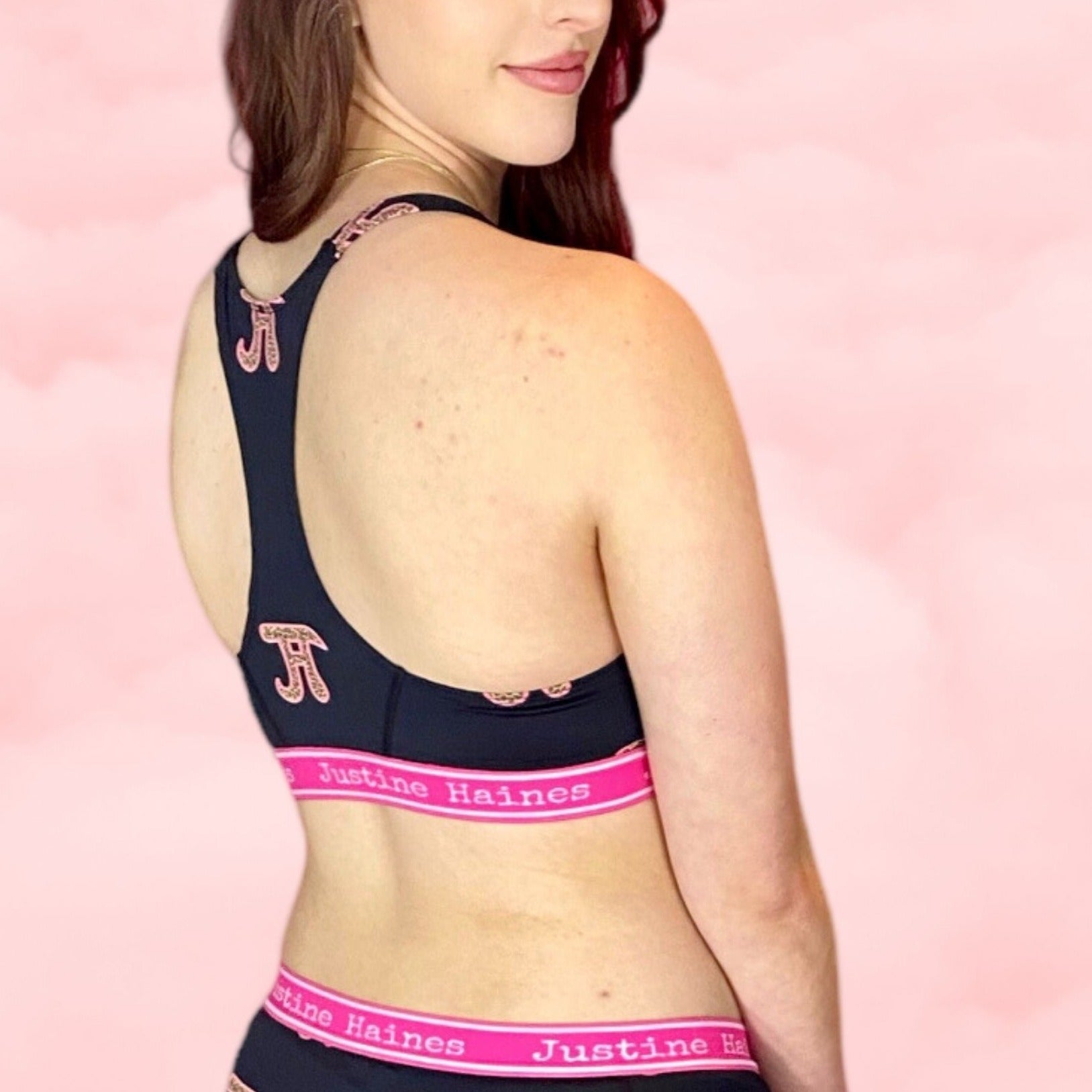 https://www.justinehaines.com/products/full-coverage-t-back-racer-sports-bra-in-jh-logo-with-leopard