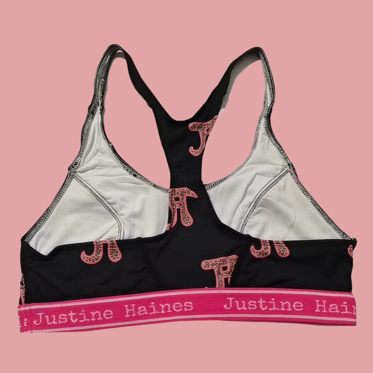 https://www.justinehaines.com/products/full-coverage-t-back-racer-sports-bra-in-jh-logo-with-leopard
